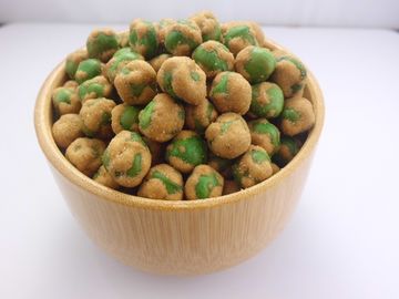 ビタミンおよび蛋白質によって揚げられているグリーンピースの軽食のシャキッとしたぴりっとする味